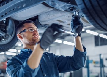 Portrait,Shot,Of,A,Handsome,Mechanic,Working,On,A,Vehicle Portrait,Shot,Of,A,Handsome,Mechanic,Working,On,A,Vehicle